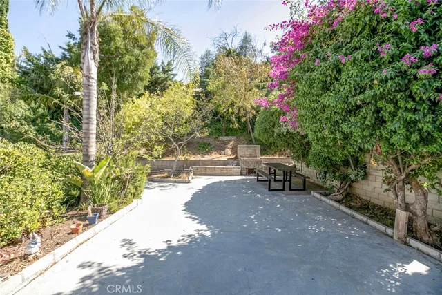 an aerial view of multi story residential apartment building with parking