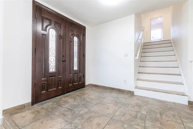 a view of room with window and hardwood floor