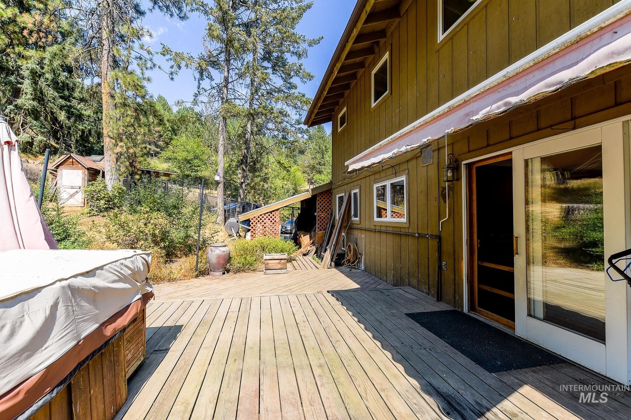1045 Joyce Road Moscow, ID 83843 - Photo 42 of 50 Expansive wood-plank deck with a sliding glass door entry