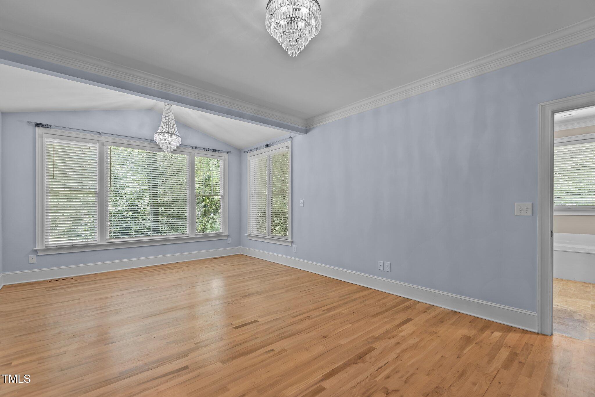 3600 Trail 23 Durham, NC 27707 - Photo 23 of 68 a view of an empty room with a window and wooden floor