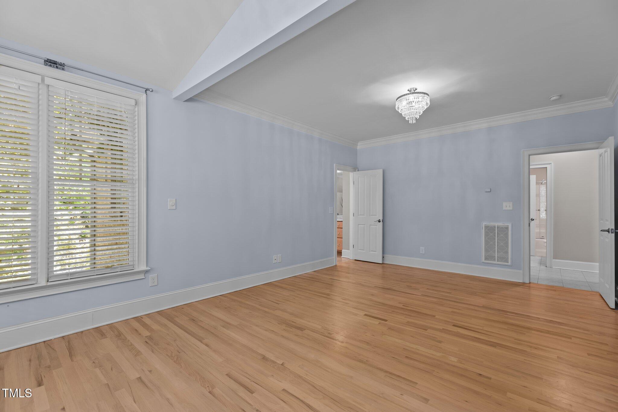 3600 Trail 23 Durham, NC 27707 - Photo 24 of 68 a view of an empty room with wooden floor and a window