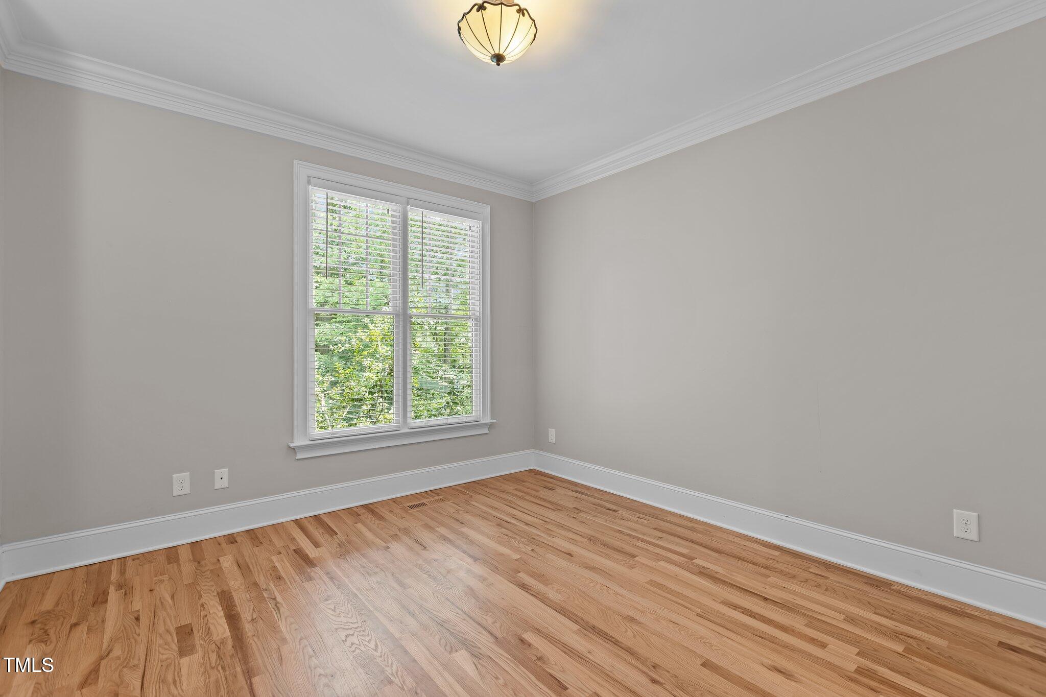 3600 Trail 23 Durham, NC 27707 - Photo 29 of 68 wooden floor in an empty room with a window