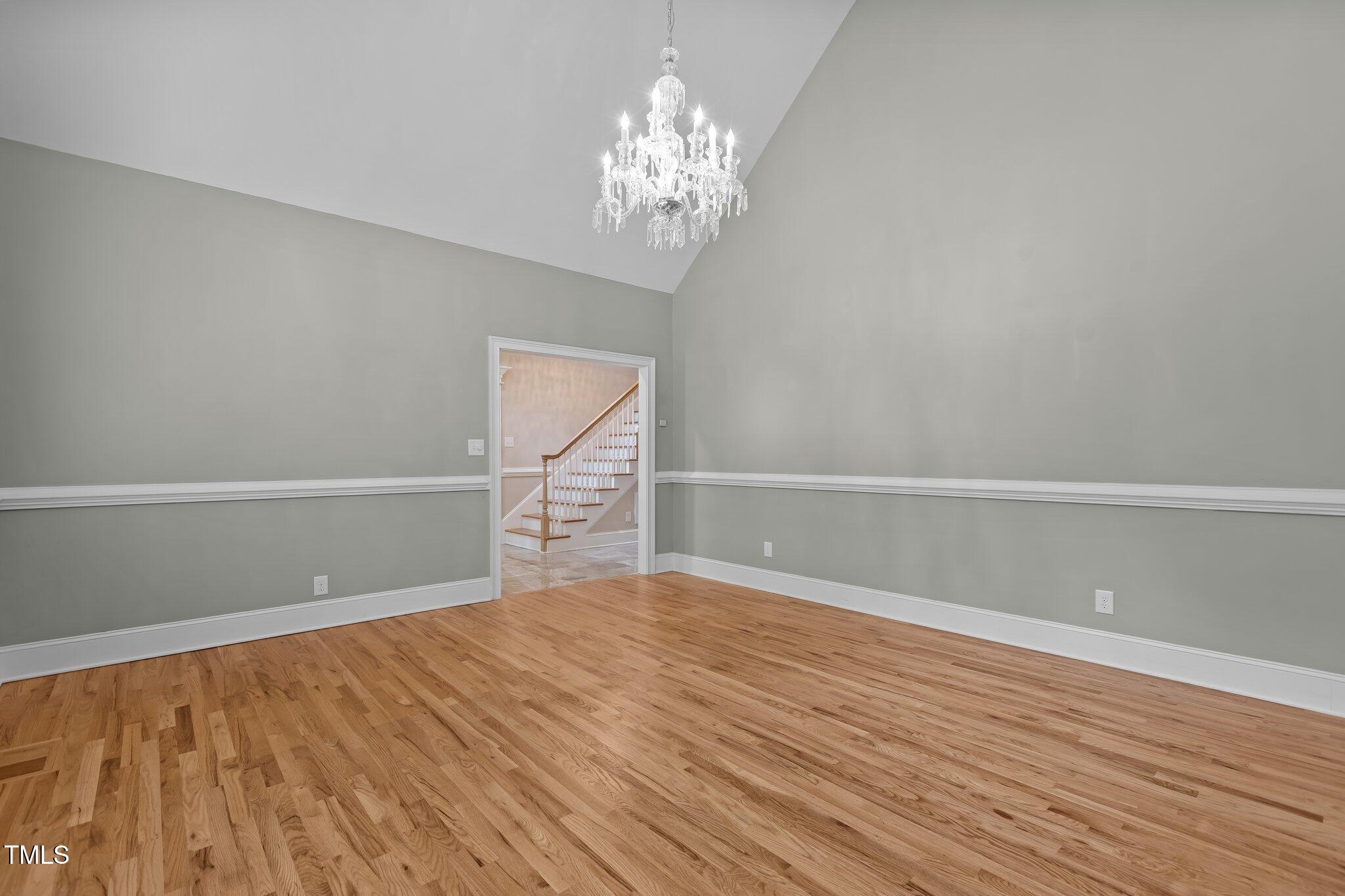 3600 Trail 23 Durham, NC 27707 - Photo 4 of 68 a view of empty room with wooden floor and fan