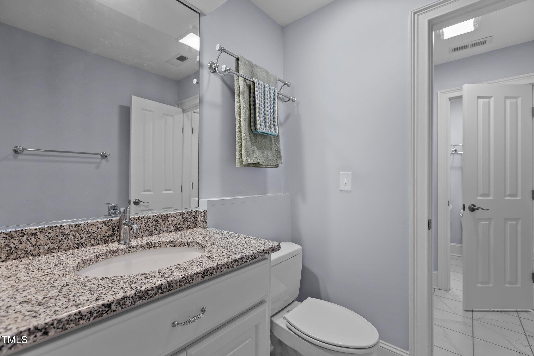 3600 Trail 23 Durham, NC 27707 - Photo 43 of 68 a bathroom with a granite countertop sink toilet and shower