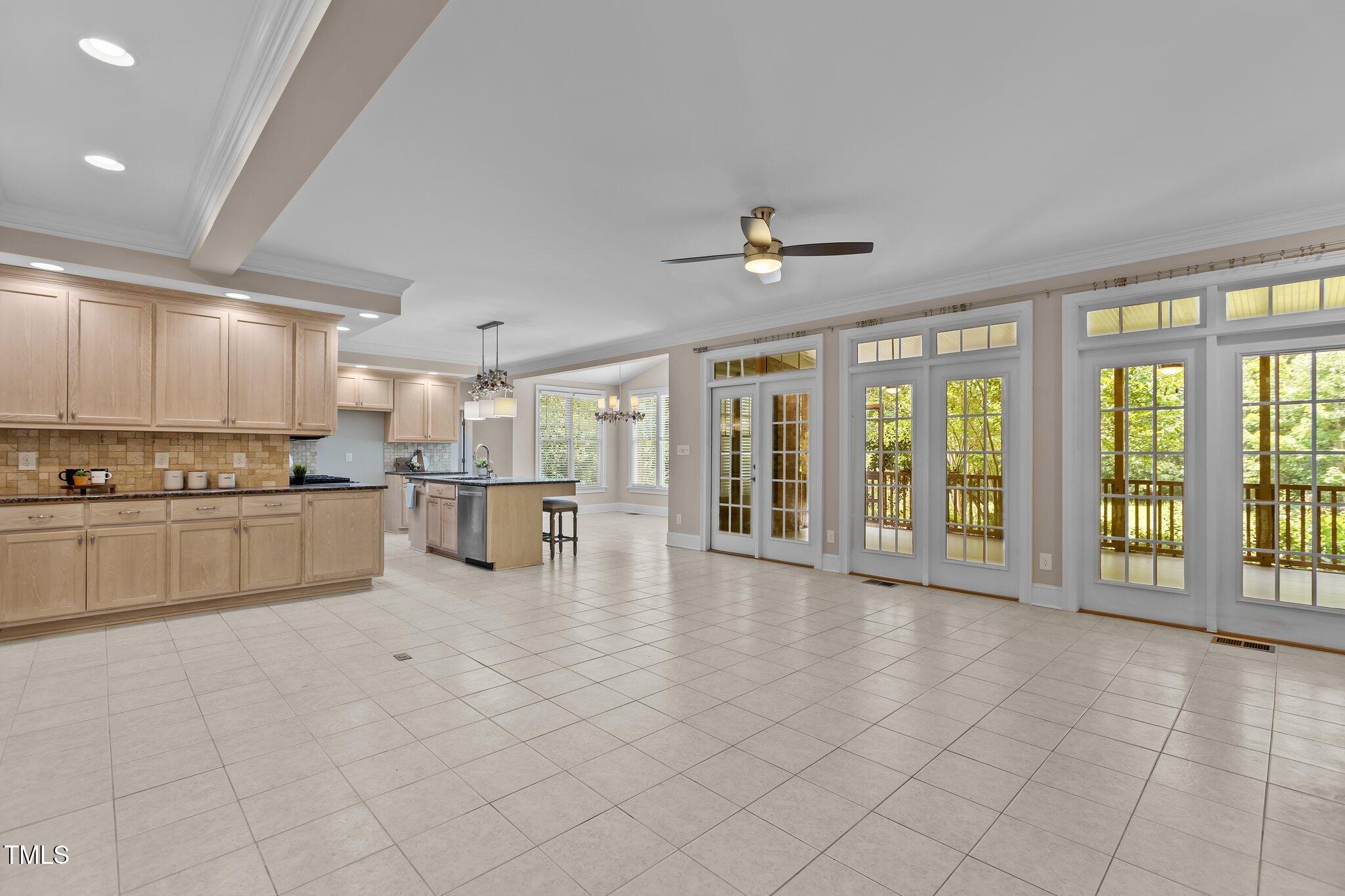 3600 Trail 23 Durham, NC 27707 - Photo 10 of 68 a large white kitchen with kitchen island a large window and cabinets