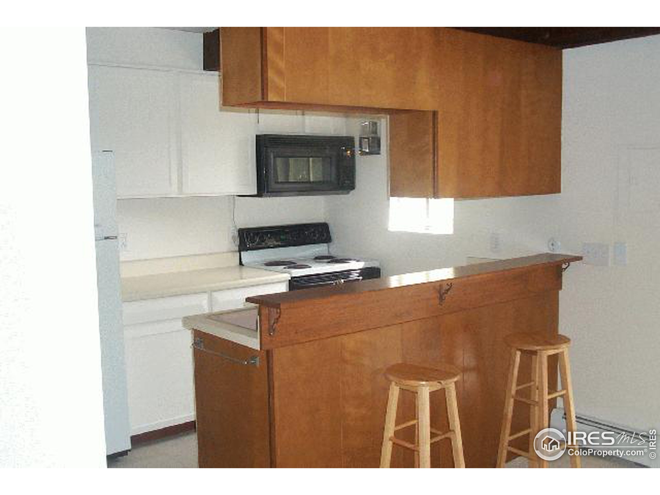 3582 Broadway Boulder, CO 80304 - Photo 4 of 6 a kitchen with a cabinets and a stove