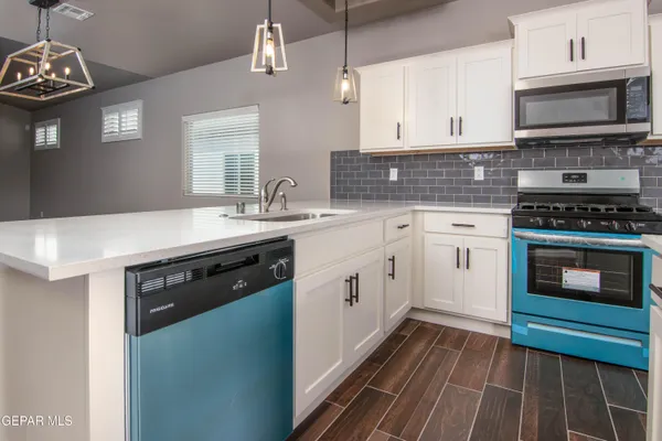 a spacious bathroom with a granite countertop sink and a mirror