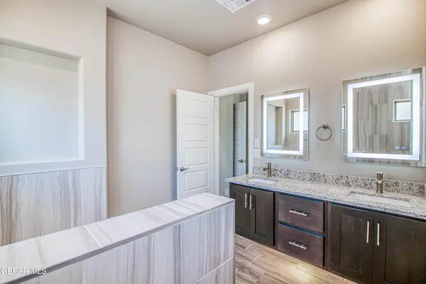 a white bath tub sitting in a bathroom