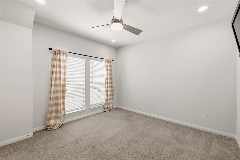 1313 Kirkwood Road Rockwall, TX 75087 - Photo 29 of 39 Bedroom #3 with bathroom nearby in the hallway.