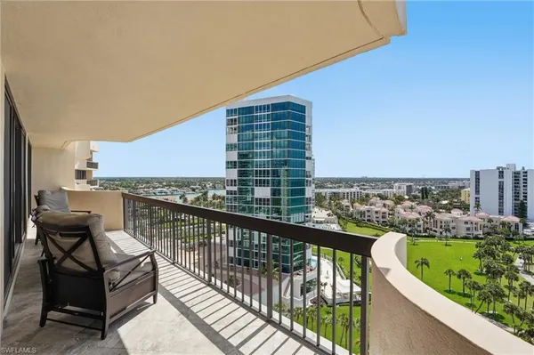 a view of balcony with furniture