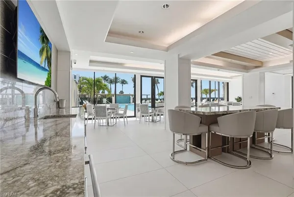 a view of a dining room with furniture window and outside view