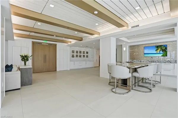 a gym room with lots of furniture