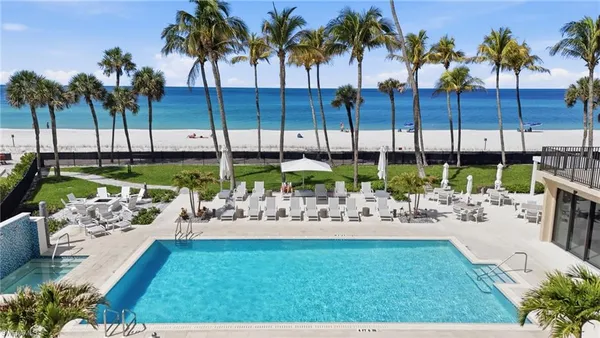 a front view of a house with wooden floor and a potted plant
