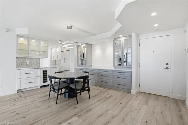 a kitchen with a table and chairs in it