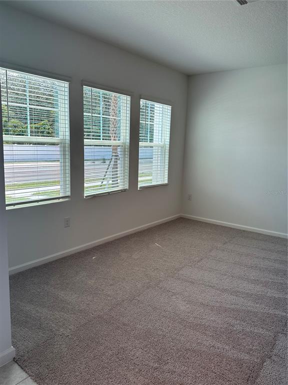 374 Cadberry Place St. Cloud, FL 34771 - Photo 4 of 11 an empty room with a window