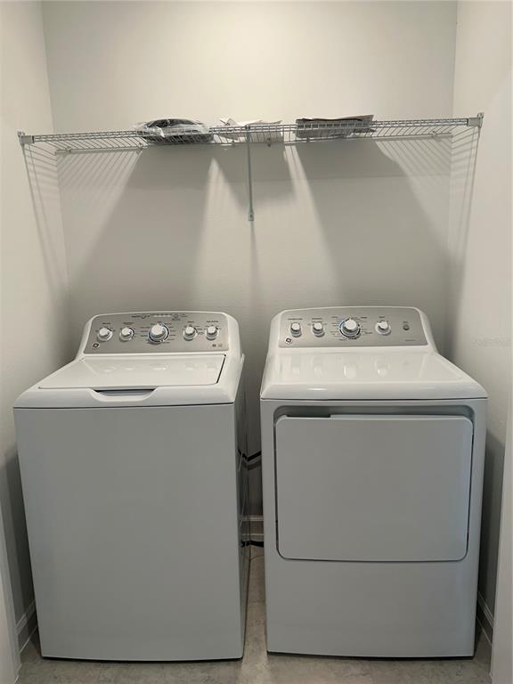 374 Cadberry Place St. Cloud, FL 34771 - Photo 7 of 11 a utility room with dryer and washer
