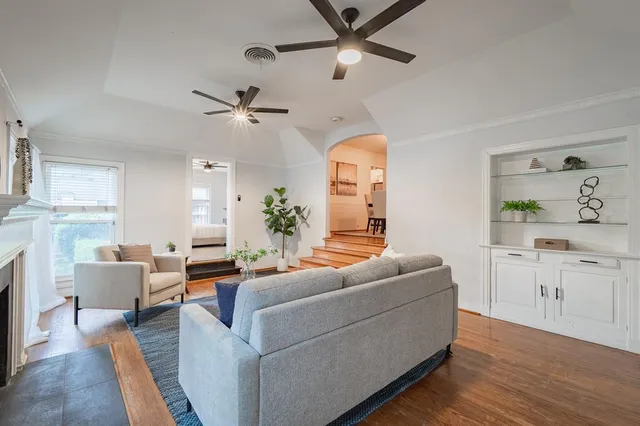 a living room with furniture and a fireplace