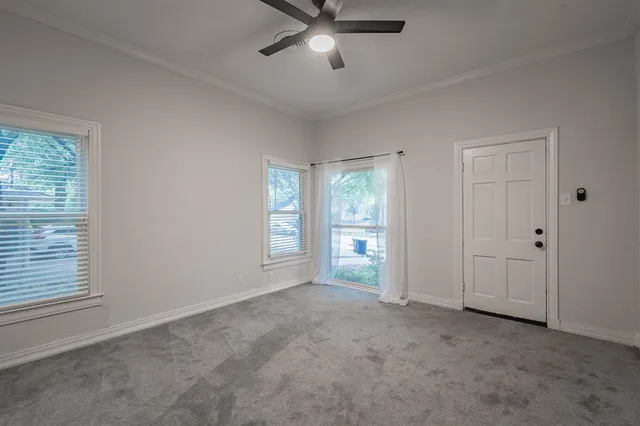 a view of an empty room with a window