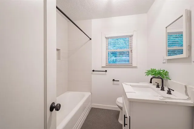 a bathroom with a sink and a bathtub