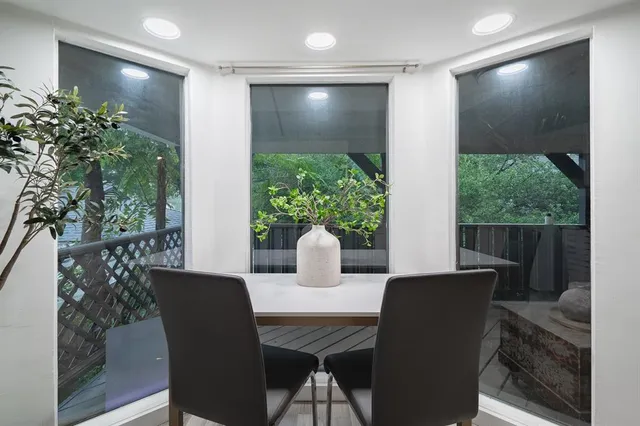 a dining room with furniture and wooden floor