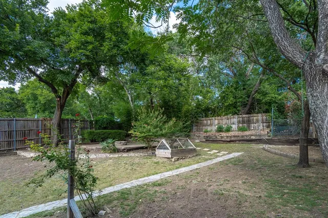 a backyard of a house with lots of green space
