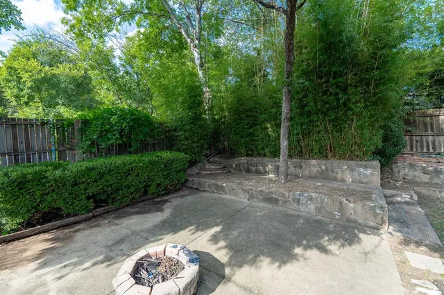a view of a backyard with a trees