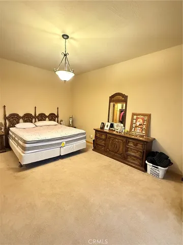 a living room with furniture a dining table and a piano table