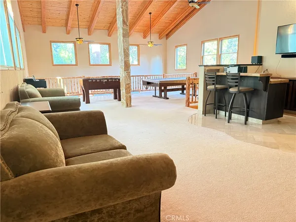 a balcony with wooden floor and deck