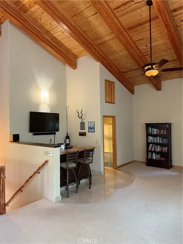 a view of balcony with wooden floor and fence