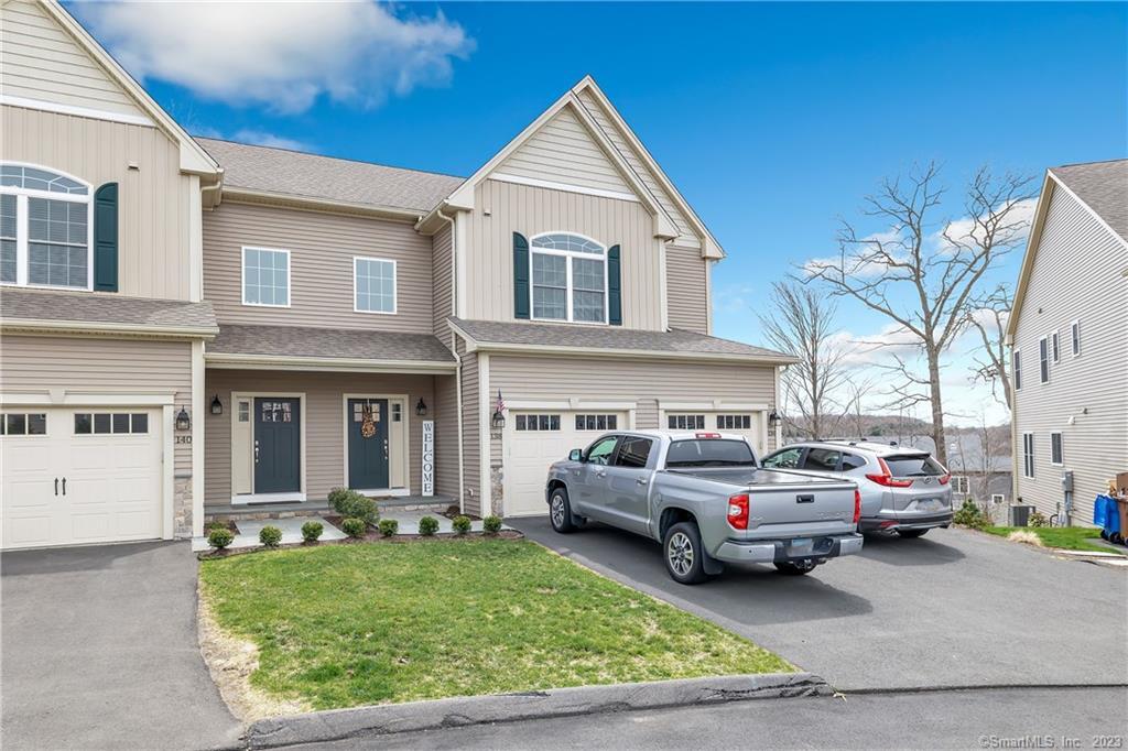 138 Wells View Road, Unit 138 Shelton, CT 06484 - Photo 1 of 1 a view of a white car parked in front of a house