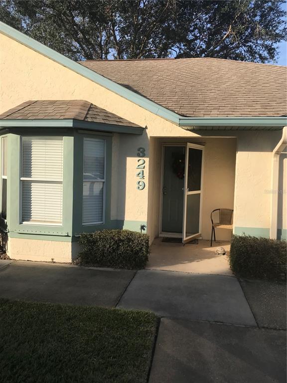 3249 Villa Way Circle St. Cloud, FL 34769 - Photo 1 of 1 a front view of a house with a yard and garage