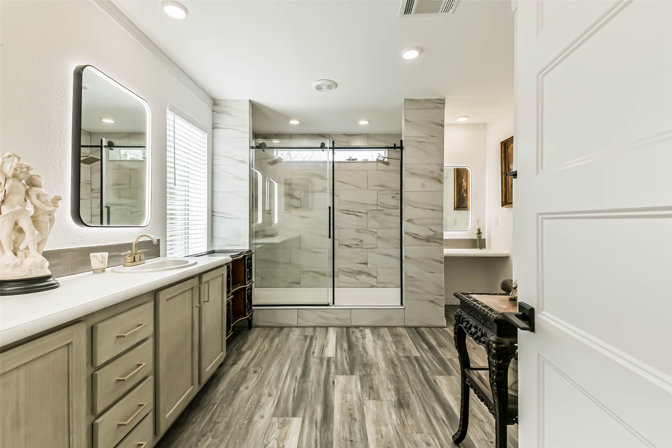 17700 Fregia Road Hull, TX 77564 - Photo 4 of 42 Master bath w/ back-lit mirrors throughout & Large double headed shower.