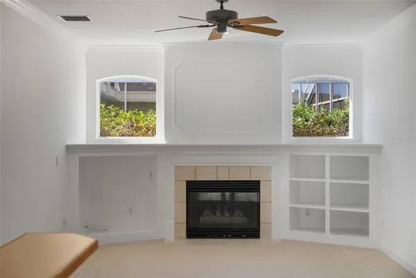 an empty room with windows and closet