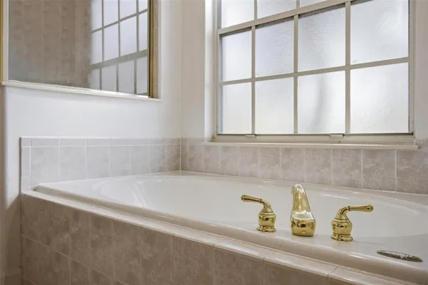 a view of a kitchen with a sink and stainless steel appliances