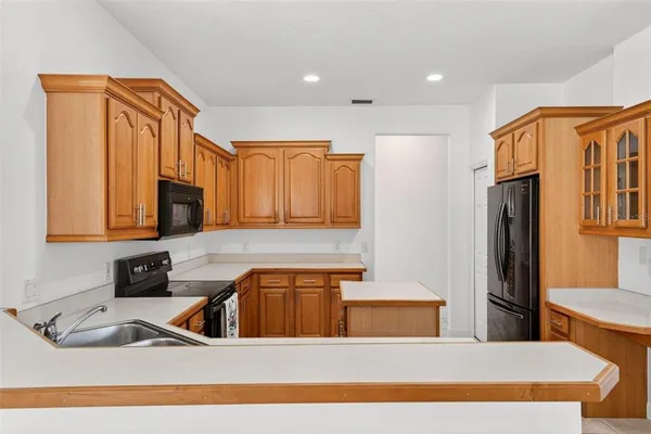 a spacious bathroom with a sink and a mirror