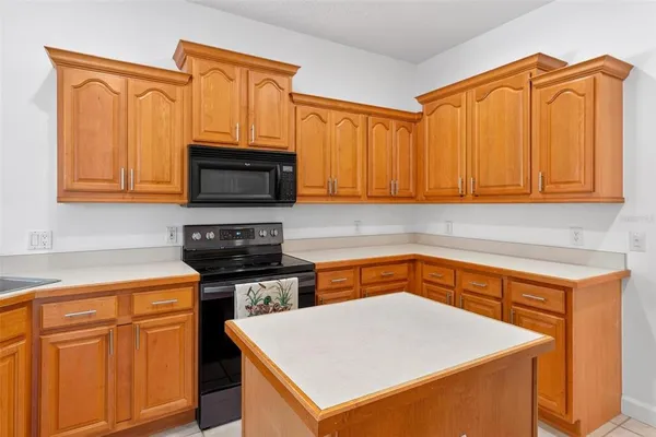 an empty room with closet and windows