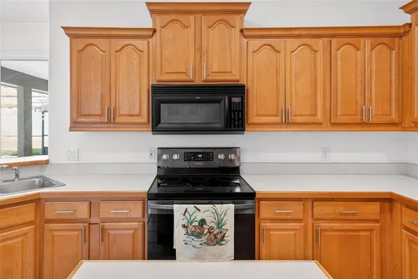 a view of a livingroom with a ceiling fan and window