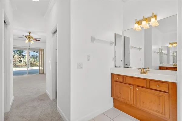 a view of a backyard with a table and chairs and potted plants