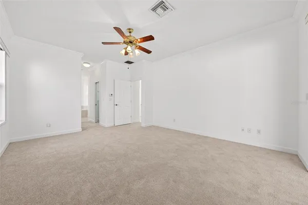 a view of a house with pool and sitting area