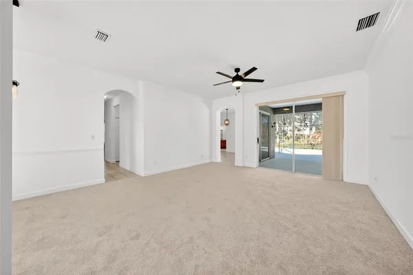 a view of livingroom with hardwood floor and a ceiling fan