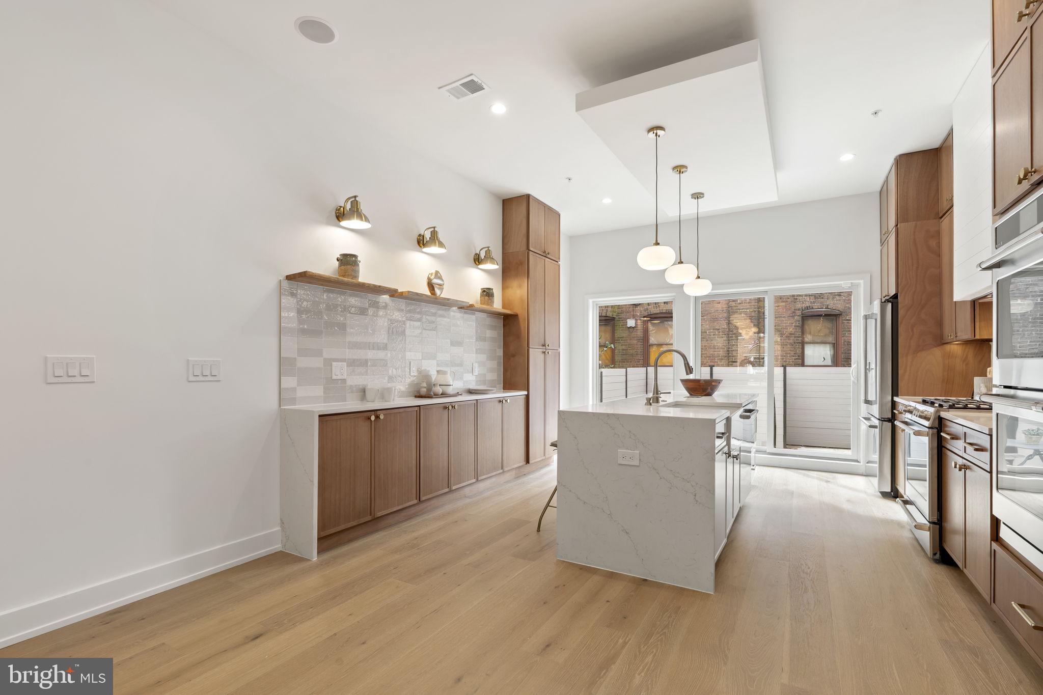 503 Winton Street Philadelphia, PA 19148 - Photo 11 of 65 a living room with furniture and a fireplace