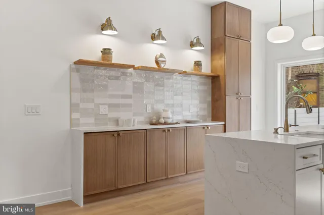 a view of a patio with a table and chairs and wooden floor