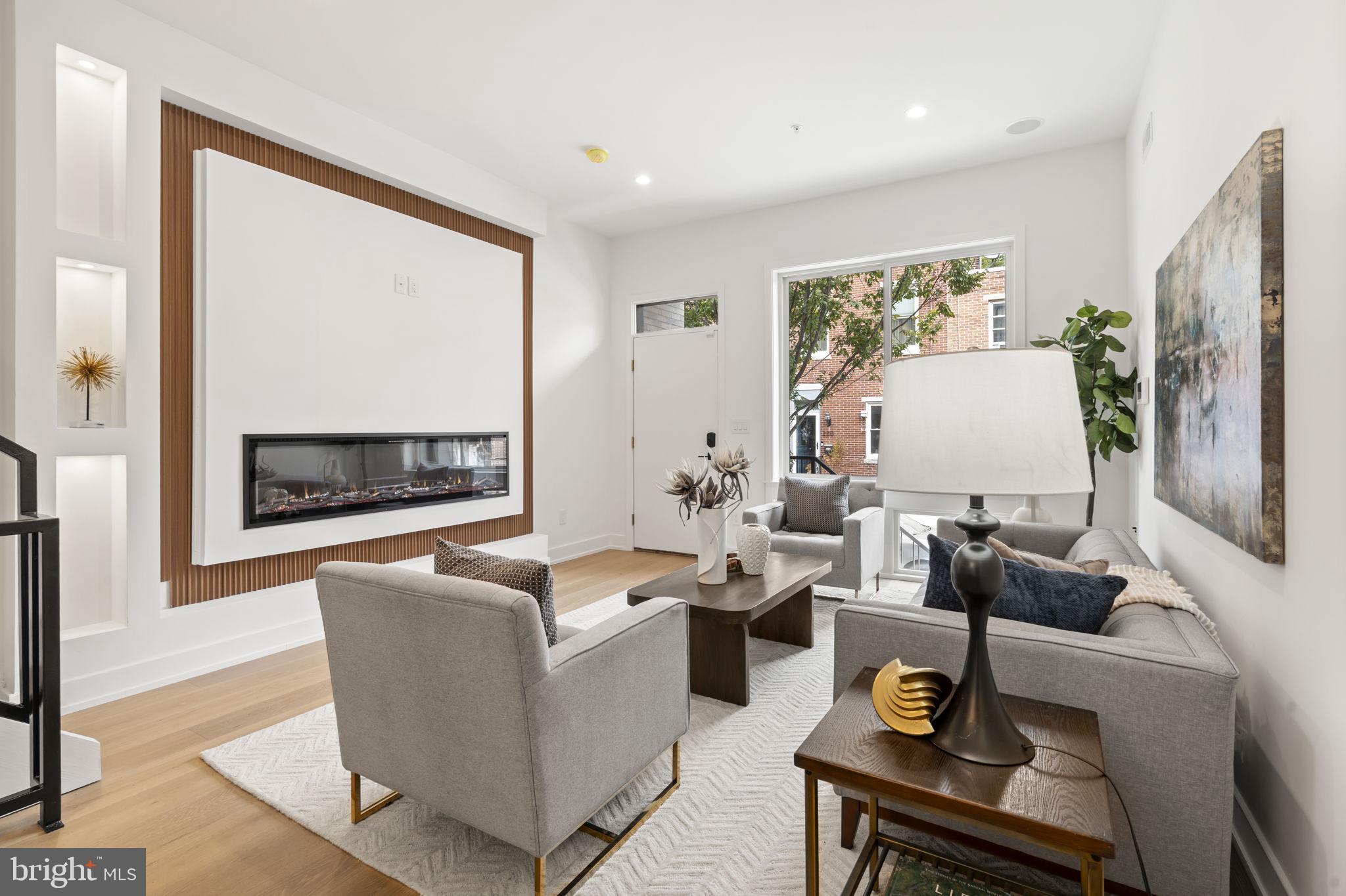 503 Winton Street Philadelphia, PA 19148 - Photo 2 of 65 a living room with furniture flat screen tv and a large window