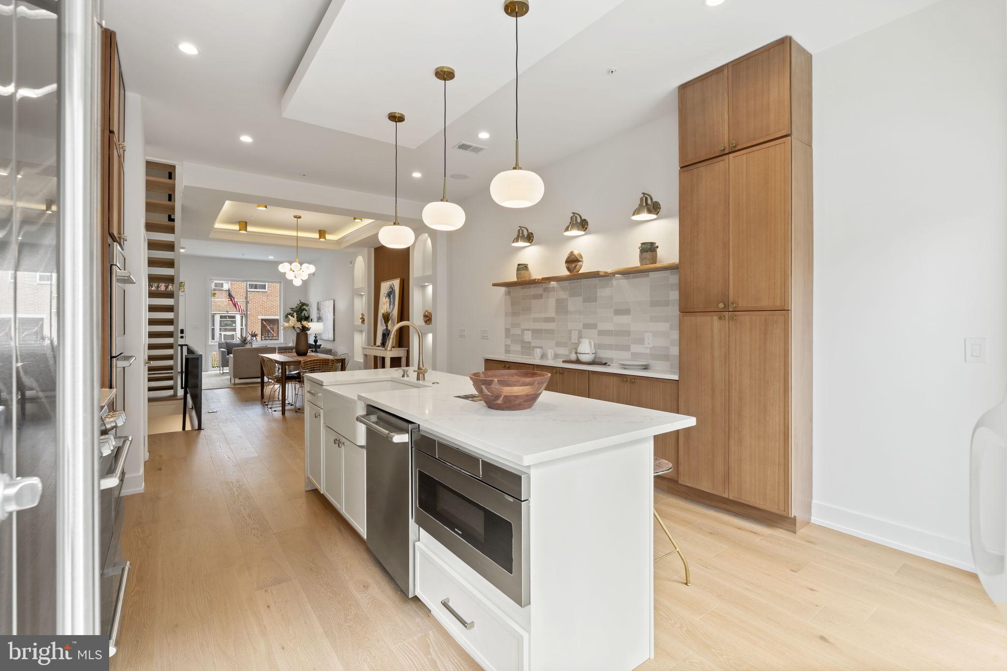 503 Winton Street Philadelphia, PA 19148 - Photo 21 of 65 a kitchen with a sink a stove and a refrigerator