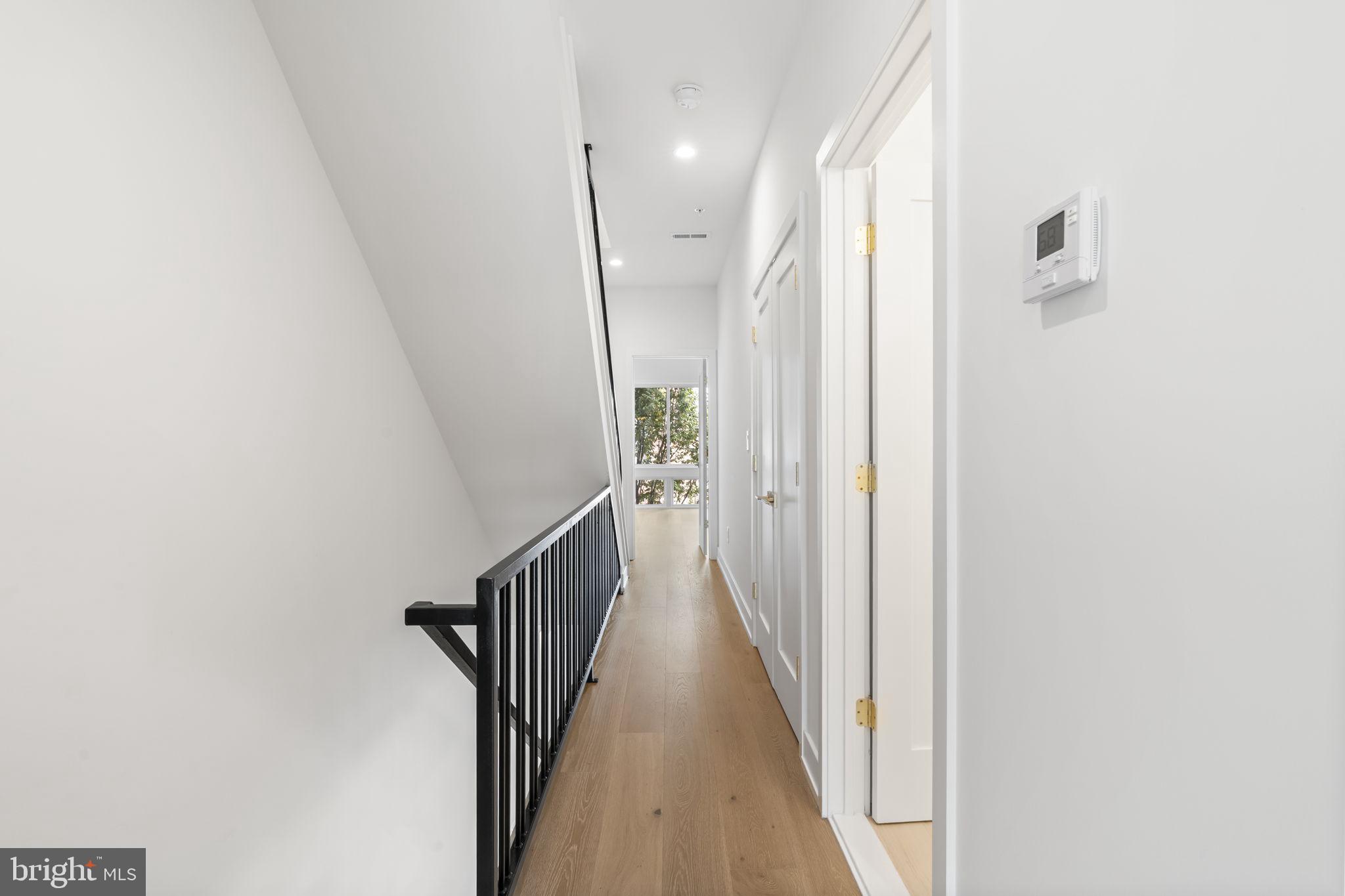 503 Winton Street Philadelphia, PA 19148 - Photo 26 of 65 a view of a hallway with wooden floor and staircase