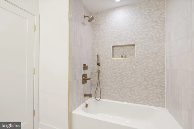 a spacious bathroom with a granite countertop sink and a mirror