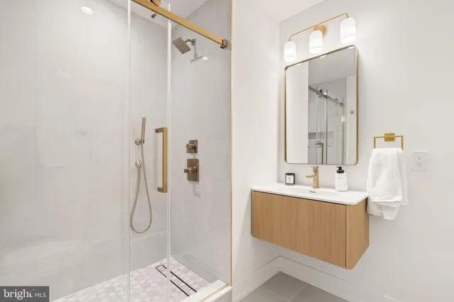 a bathroom with a bathtub and next to a window