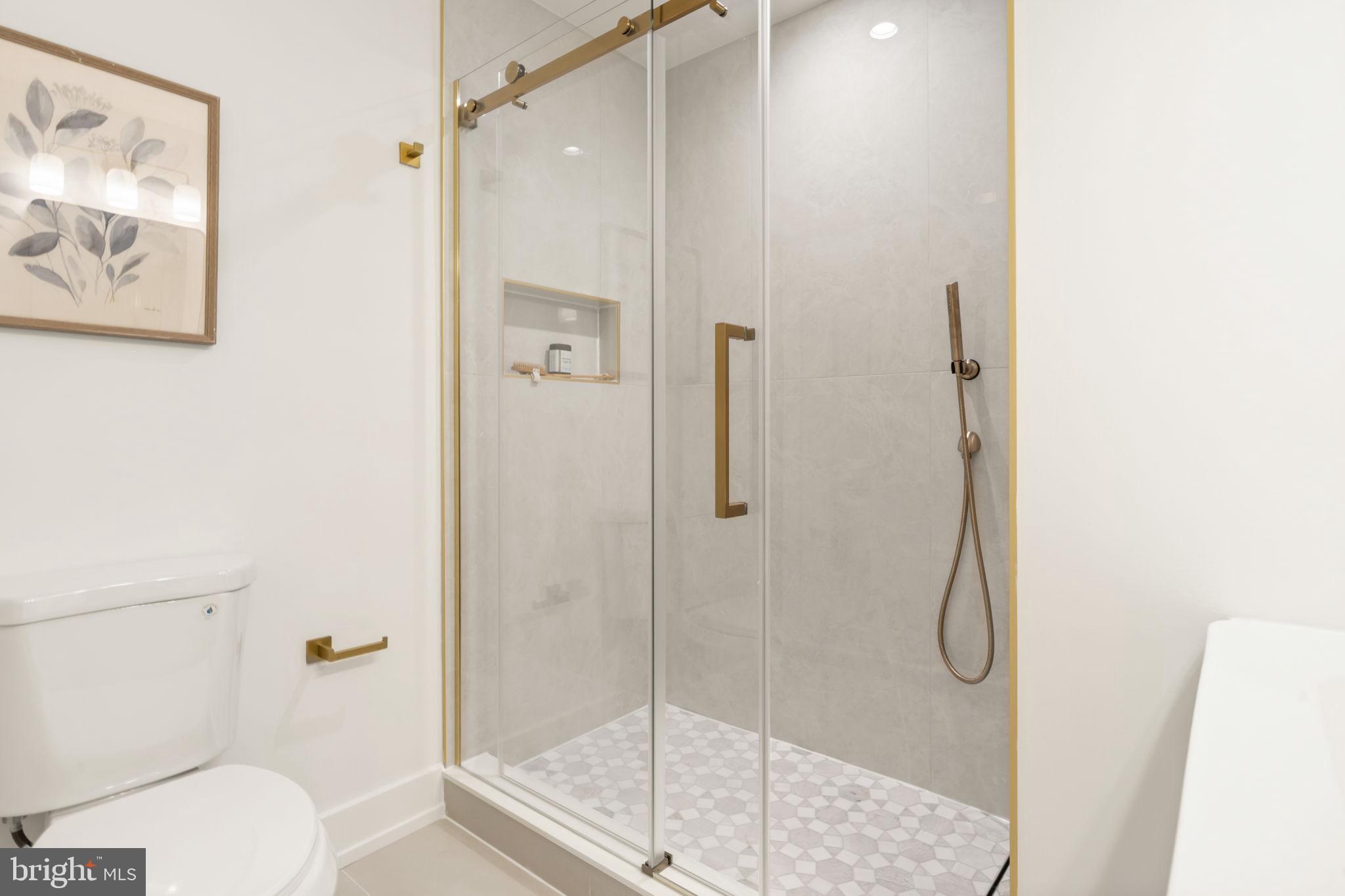 503 Winton Street Philadelphia, PA 19148 - Photo 35 of 65 a bathroom with a shower and toilet