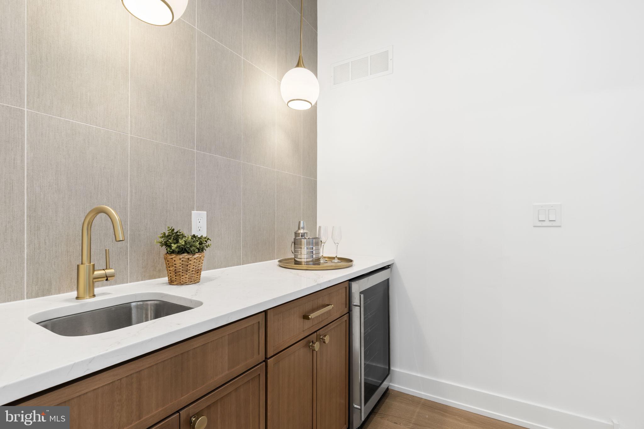 503 Winton Street Philadelphia, PA 19148 - Photo 40 of 65 a bathroom with a sink and a mirror