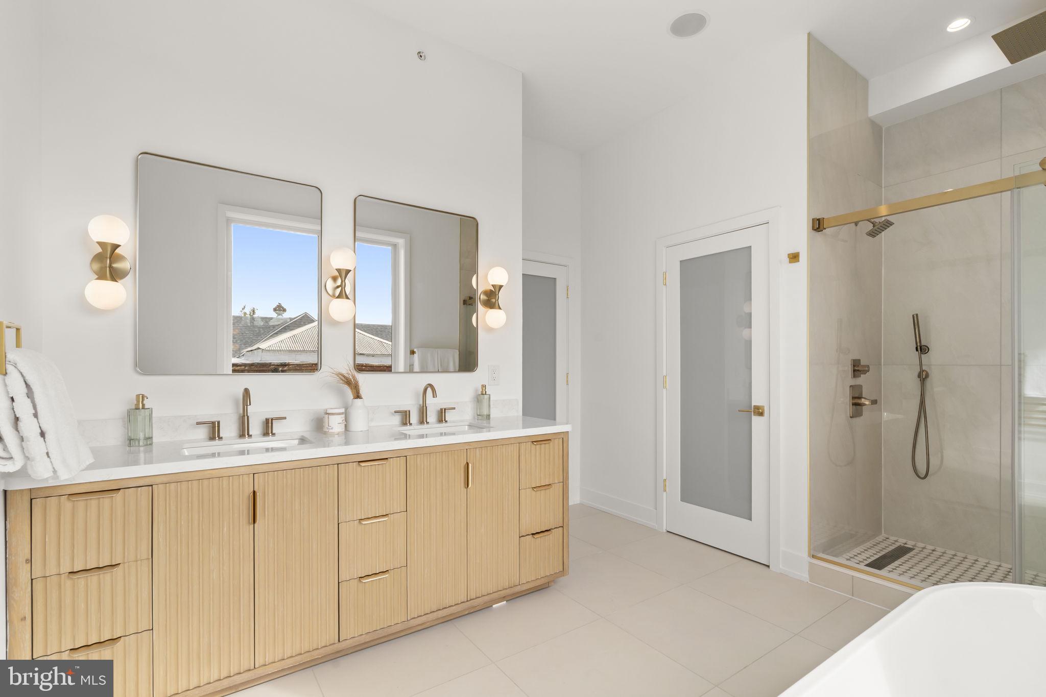 503 Winton Street Philadelphia, PA 19148 - Photo 45 of 65 a spacious bathroom with a double vanity sink mirror and shower
